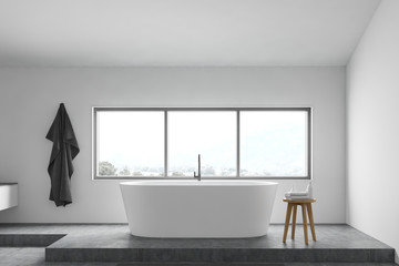 Fototapeta premium White bathroom interior with bathtub