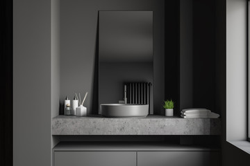 Close up of sink in gray bathroom