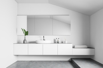 White bathroom interior with sink and mirror