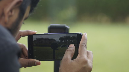 man with mobile camera