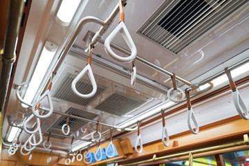 hand straps in empty tokyo train