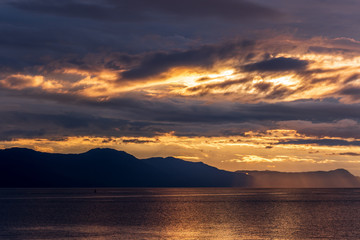 View of ocean sunset over mountains in beautiful British Columbia.