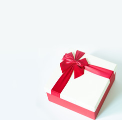 gift box with red ribbon on white background.Christmas and New Year's gift concept.