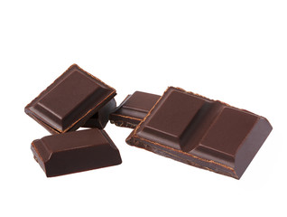 Dark chocolate pieces isolated on white background.