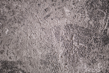 Texture and background of an old black and gray concrete wall. Cement
