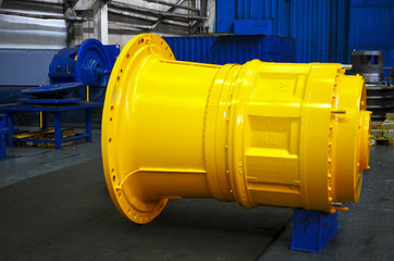 Motor-wheel gear for dump truck in the workshop of automative plant. Planetary gearboxes and electric drives for quarry machinery, and earthmoving equipment. Manufacture hybrid-diesel engines, reducer