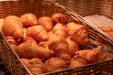 Close up croissants bakery in square bamboo basket