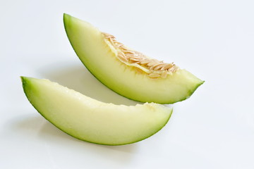 Japanese green melon cutting for piece on white background