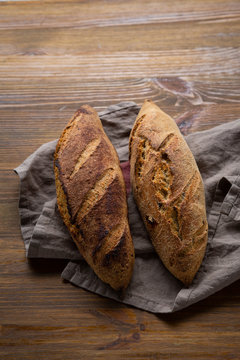 Two Loaf Of Artisan Bread Top View On Rustic Background