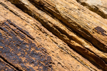 Textured stone surface with traces of erosion.