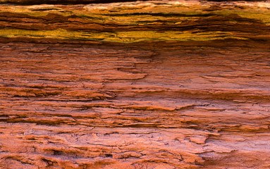 Layered surface of the stone with traces of erosion.