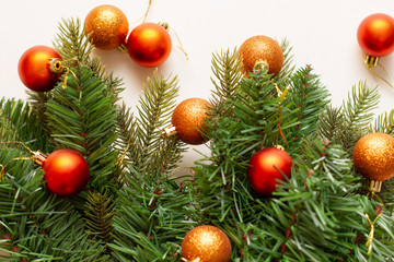 Orange christmas balls on tree branch. Flat lay