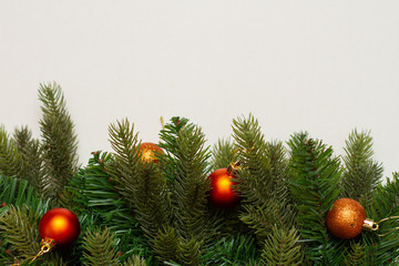 Christmas decor with Christmas balls on white background. Free space for text 