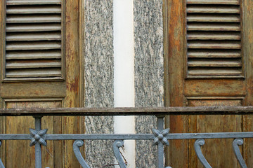 Two wooden doors and two granites jambs and a metallic and wooden balustrade