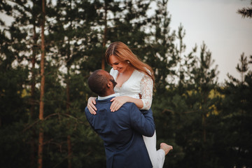 beautiful mixed couple of newlyweds