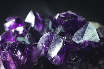 amethyst with light shine on, on black background