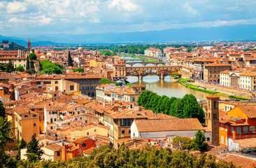 View of medieval stone bridge Ponte Vecchio over Arno river in Florence, Tuscany, Italy. Florence cityscape. Florence architecture and landmark.
