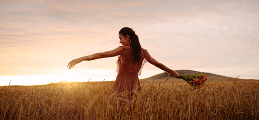 Happy woman enjoying in wheat field © Jacob Lund
