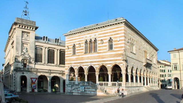 Timelapse of Udine, people walking in the street near Loggia del Lionello in the main city of Friuli-Venezia Giulia