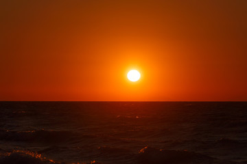 Fototapeta na wymiar An image of a nice red sunset with big yellow sun