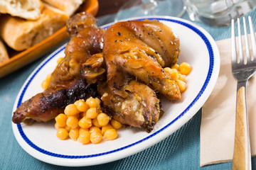 Baked pig trotters with garbanzos