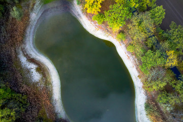 Aerial photograph from a height of one hundred metres onto an artificial blue-green pond