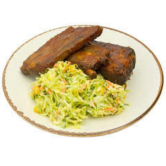 fried pork ribs with salad without background on a plate