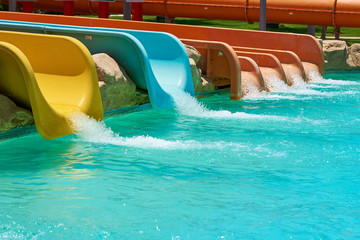 Colorful water slides in aqua park, closeup