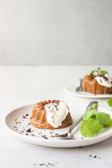 Chocolate dessert decorated with whipped cream, grated chocolate and mint. Traditional Italian dessert panna cotta. Selective focus.