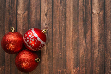 red christmas decoration on wooden background