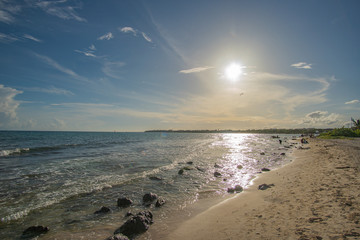 Beach and waves of Caribbean Sea in the sun