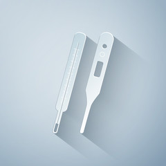 Paper cut Classic Medical thermometer and digital thermometer for medical examination icon isolated on grey background. Paper art style. Vector Illustration
