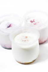 assortment of yogurts with fruit additives, vertical top view