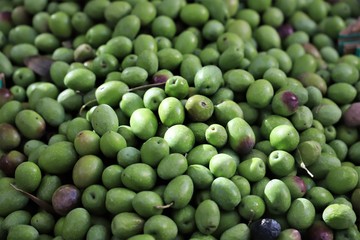 olives on display in a market stall