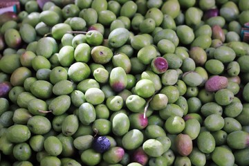 olives on display in a market stall