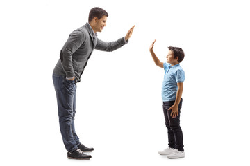 Father and son gesturing high-five