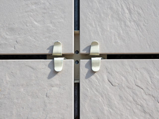 Fragment of a ventilated facade made of ceramic tile