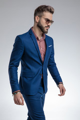 Fototapeta premium sexy fashion model in blue suit wearing sunglasses