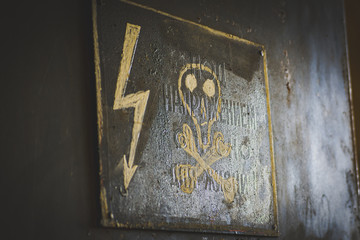 electricity warning sign on the wall