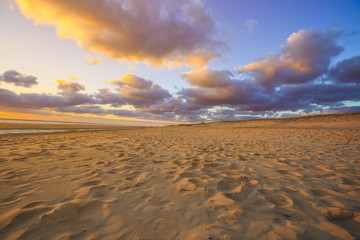 Fototapeta premium Sand dune on beach at sunsetas for nature background
