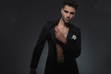 dramatic young model holding hand in a fashion pose