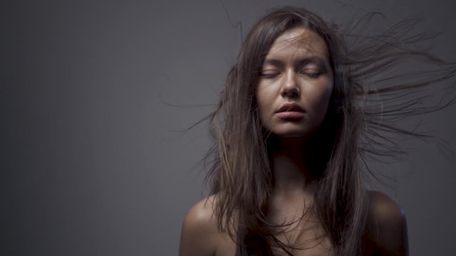 Slow motion girl hair. hair fluttering in the wind.