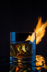 fire ice whiskey glass on a dark background