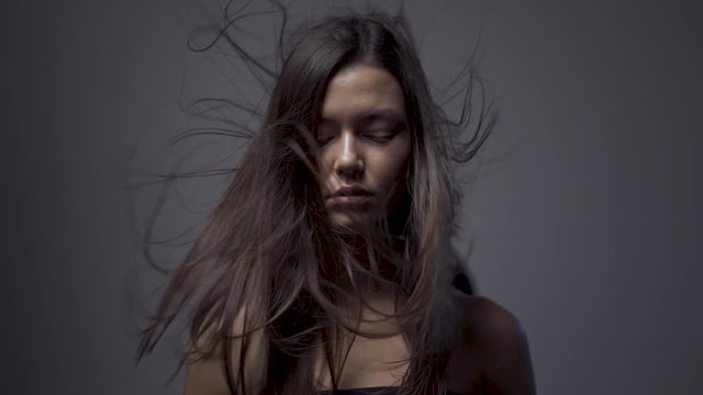 Slow motion girl hair. hair fluttering in the wind.