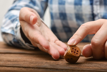 The dice in female hand close up.
