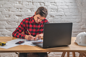 civil engineer at his Desk working with documents