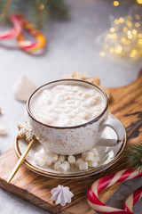 Obraz na płótnie Canvas Hot chocolate cacao drinks with marshmallows in Christmas color mug on grey background. Traditional hot beverage, festive cocktail at X-mas or New Year