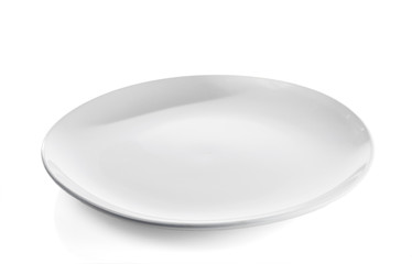 The flat white ceramic plate isolated on a white background.