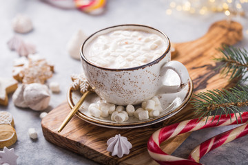 Obraz na płótnie Canvas Christmas holiday cacao. Hot chocolate cacao drinks with marshmallows in Christmas mugs on grey background. Traditional hot beverage, festive cocktail at X-mas or New Year