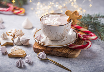 Hot chocolate cacao drinks with marshmallows in Christmas mugs on grey background. Traditional hot beverage, festive cocktail at X-mas or New Year